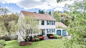 Image of the front of a 2-story colonial style home in Taunton, MA.