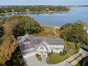 Aerial (drone) image of a 2-story colonial style home on Cape Cod, MA.